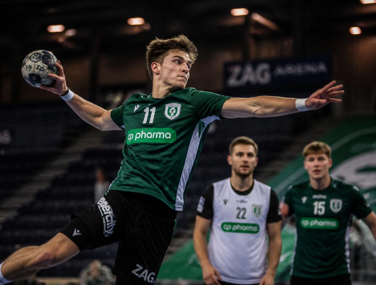 Handball team training in modern indoor arena